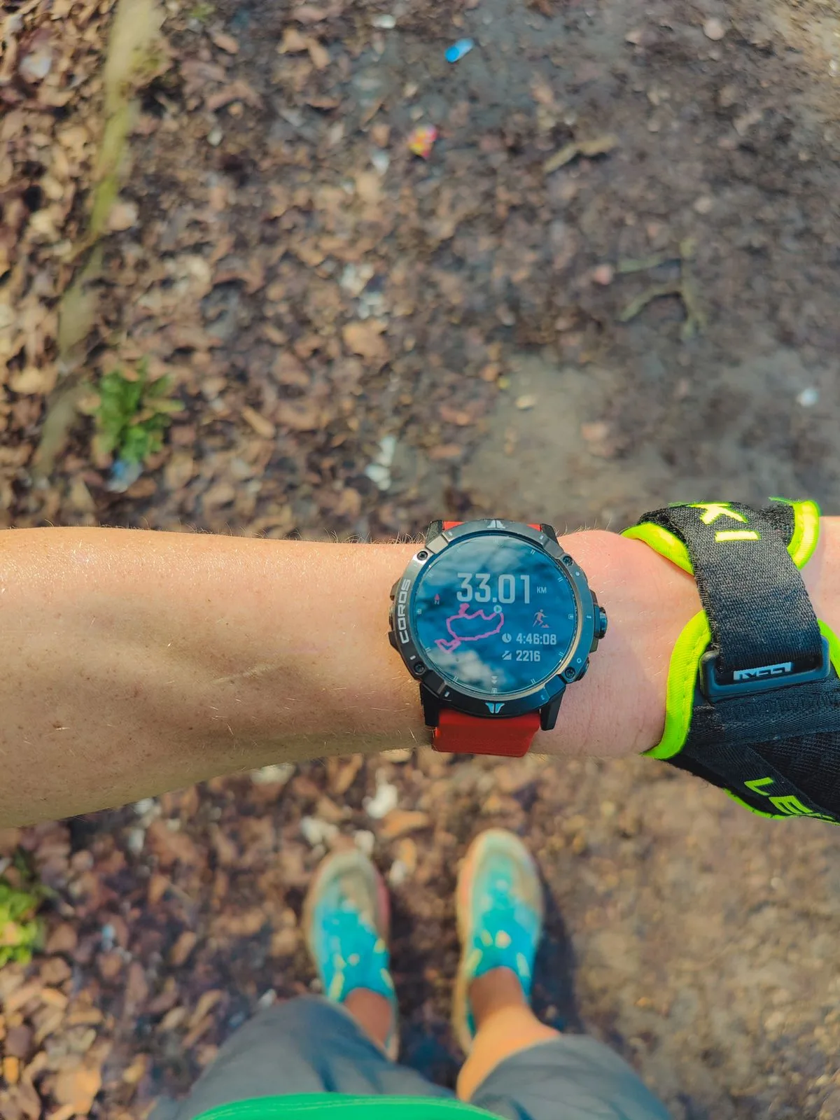 A runner checking a sports watch after an outdoor run
