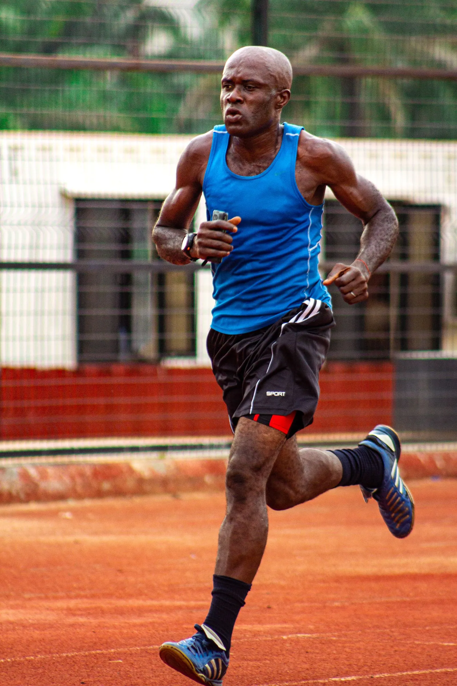 An athlete training on an outdoor running track