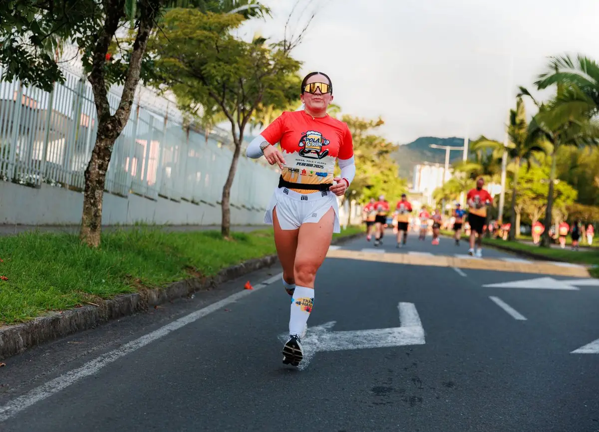 Woman running in a vibrant marathon event.
