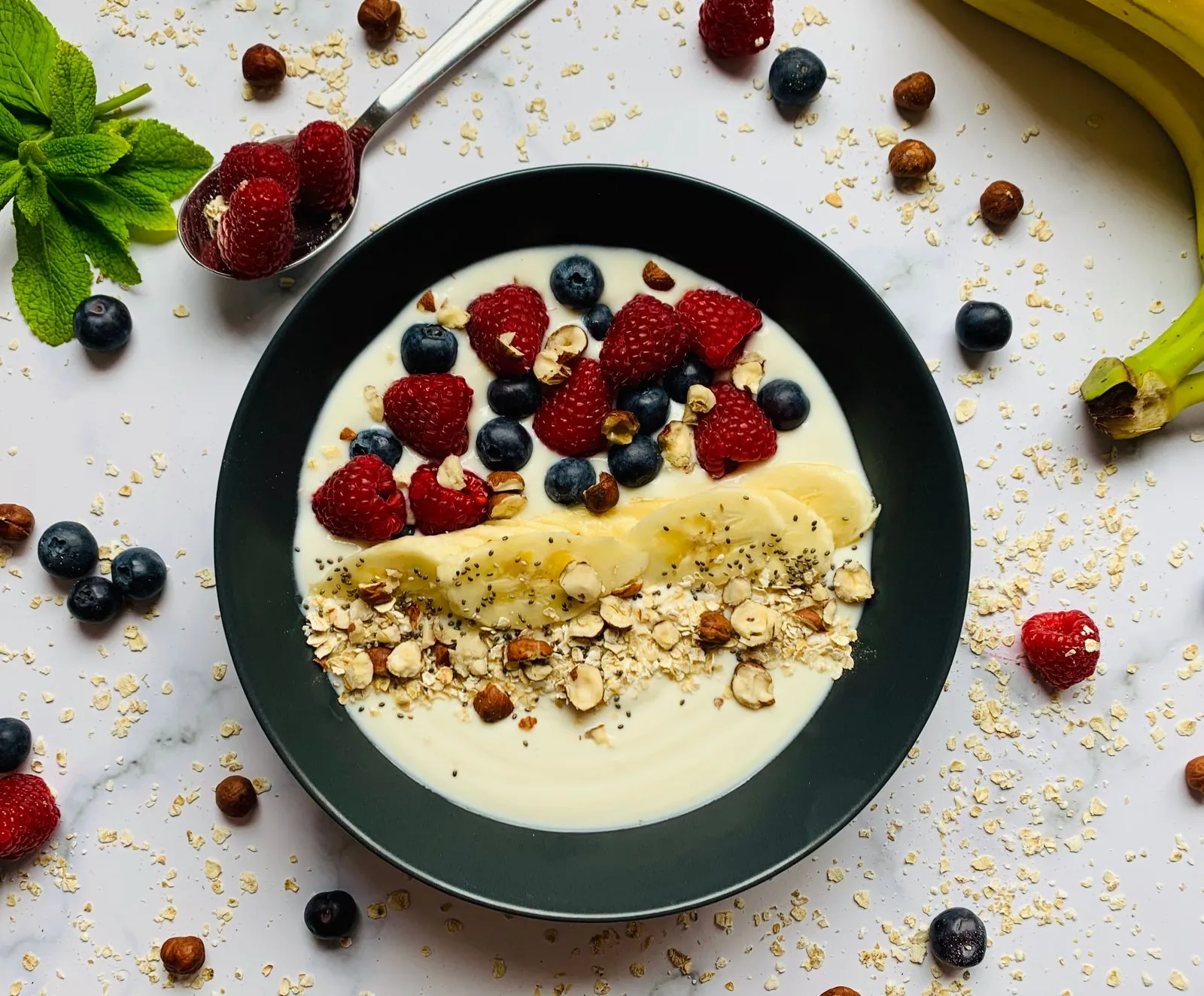 A breakfast bowl topped with fruit