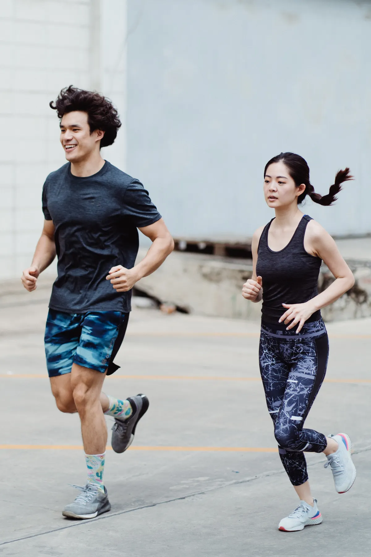 Two runners training together outdoors