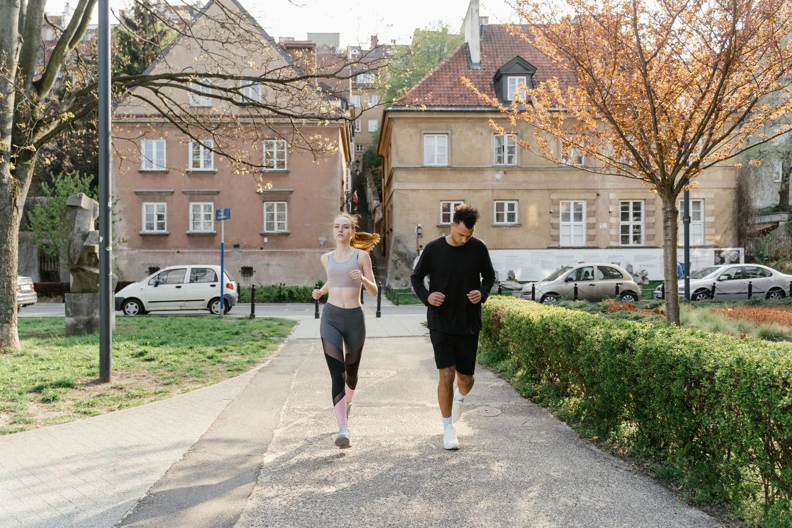 Two runners sharing a park route