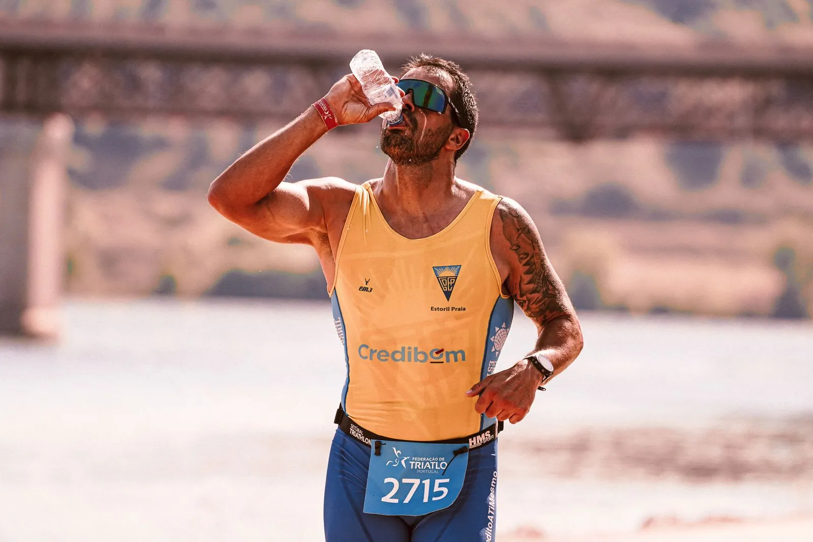A runner takes a drink during a race