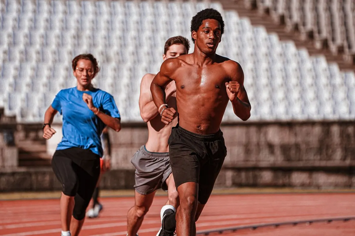 Athletes training together on an outdoor running track
